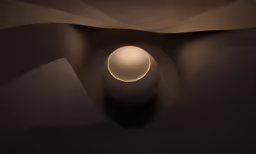 a white ball in between two black structures