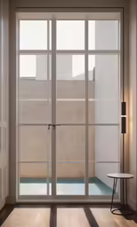 the door to an interior balcony leads into a sunlit outdoor space