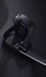a black camera and its reflection in a mirror