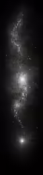 a black and white photo of a bright object on a dark background