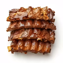 there are several bars covered in chocolate and peanut butter