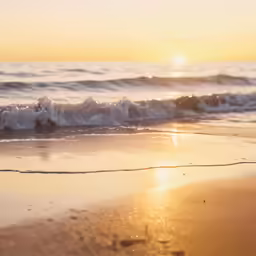 the ocean is moving fast with the sun setting in the distance