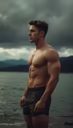 a man is looking out into the water while he poses for a photo