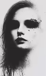 a black and white image of a woman with splatches on her face