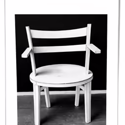 a chair is sitting in a corner by itself