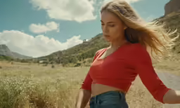 a woman with long hair is running through the air