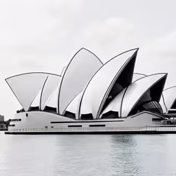 a view of a opera structure across the water