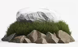 a rock that has been made to look like grass and a large boulder