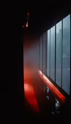 the hallway is covered in fog and light