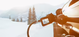 the vehicle is driving through the mountains on its side
