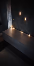 a room that has lights on a wooden counter