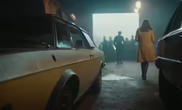 a car and people are walking towards a doorway