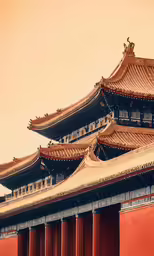 an oriental building with three tall spires and a red wall