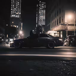 a car with the headlights on at night in the city