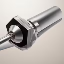 a metal object with a gray back ground