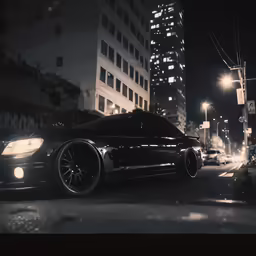 a city at night with many buildings and cars