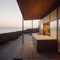 view of a modern house overlooking the ocean