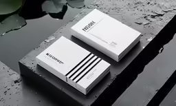 a couple of business cards sitting on top of a table