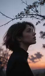 a young woman staring off into the distance
