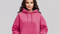 a beautiful woman wearing a pink hoodie