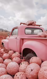 an old truck in the midst of piles of balls