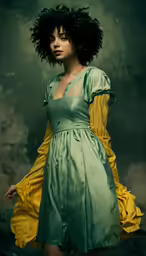 a model in green and yellow dress