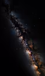 a very long and dark cloud moving across the night sky