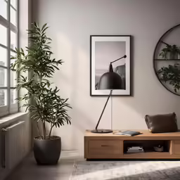 a living room with plant in the corner of the room and a poster hanging on the wall