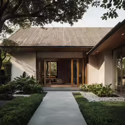 a pathway to the front door of an elegant home