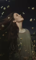 a woman with long hair and a green shirt is among butterflies