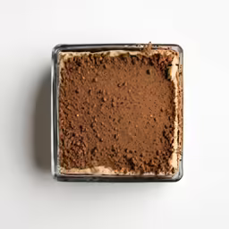 an unbaked dish of desert on a white surface