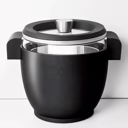 a black bowl with a metal holder and lid