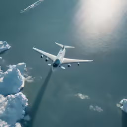 a white plane that is flying through the air