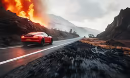 a red car driving down the road near a fire