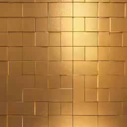 a small red tile that has been brushed gold