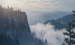 the mountains are shroud with mist on them