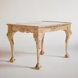 a table that looks like a plant stand with an intricate top