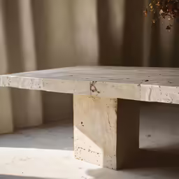 a concrete bench sitting on top of a table