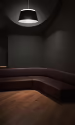 the empty dark corner of the room is lighted by a round light