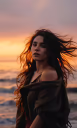 a woman with very long hair looking up at the sky