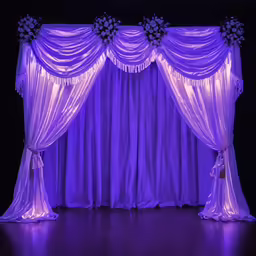 an illuminated purple backdrop for a dance event