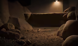 dark scene with a rock pit at night