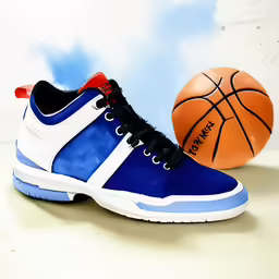 two sneakers with the same color are sitting beside a basketball