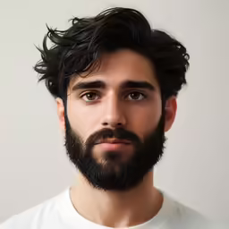 a man with a beard wearing a t - shirt
