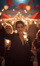 a woman holding up a lit candle at a celebration