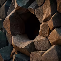 a bunch of stone stacks stacked on top of each other