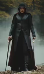 the man in the black cloak holds two swords