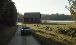 an old car sitting in front of a house