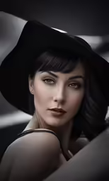 a woman in black posing with her hands on her shoulder