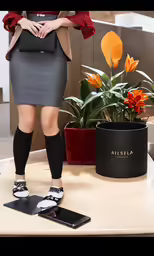 a woman in gray and black is standing on a table